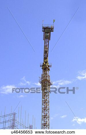 Stock Image - Outdoors, Day, Dusk, Engineering, Industrial, Crane, Sky. Fotosearch