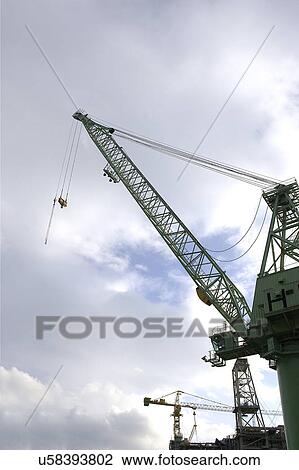 Outdoors, Day, Dusk, Engineering, Industrial, Crane, Sky View Large Photo Image Stock Image - Outdoors, Day, Dusk, Engineering, Industrial, Crane, Sky. Fotosearch