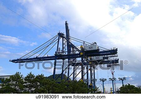 Stock Image - Outdoors, Day, Dusk, Engineering, Industrial, Crane, Sky. Fotosearch