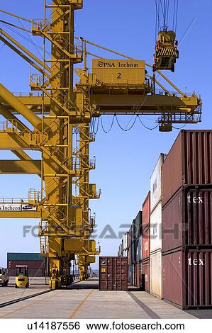 Stock Photograph - Outdoors, Day, Dusk, Engineering, Industrial, Crane, Sky. Fotosearch