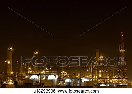 Stock Photograph - Outdoors, Day, Dusk, Engineering, Industrial, Crane, Sky. Fotosearch
