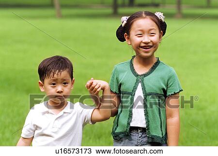 Stock Image - Outdoors, Day, Kids, Children, Playing, Playful, Playground. Fotosearch