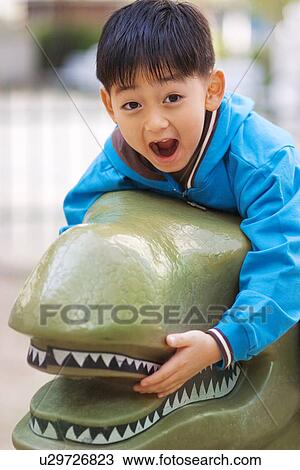 Stock Image - Outdoors, Day, Kids, Children, Playing, Playful, Playground. Fotosearch