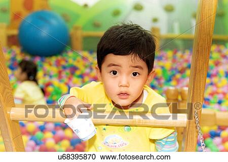 Stock Image - Outdoors, Day, Kids, Children, Playing, Playful, Playground. Fotosearch