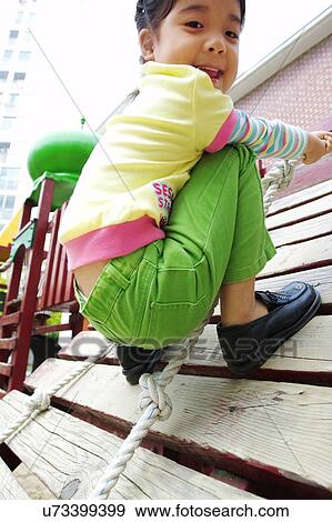 Outdoors, Day, Kids, Children, Playing, Playful, Playground View Large Photo Image Stock Photo - Outdoors, Day, Kids, Children, Playing, Playful, Playground. Fotosearch