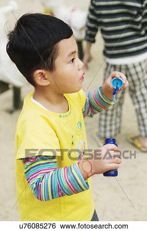 Stock Photograph - Outdoors, Day, Kids, Children, Playing, Playful, Playground. Fotosearch