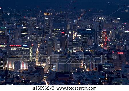 Stock Image - Outdoors, Urban Scene, Building Structure, Building Exterior, Skyscraper, Light, Illuminated. Fotosearch