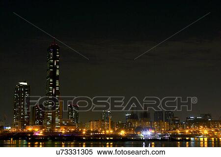 Stock Photography - Outdoors, Urban Scene, Building Structure, Building Exterior, Skyscraper, Light, Illuminated. Fotosearch