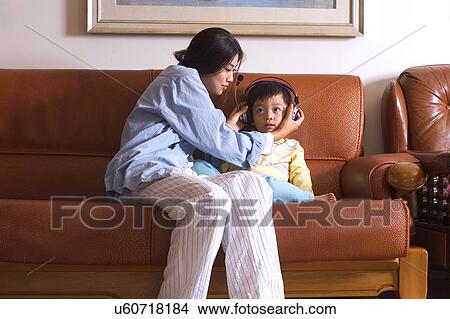 Picture - Togetherness, Mother, Love, Father, Daughter, Asian Ethnicity. Fotosearch