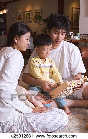 Togetherness, Mother, Love, Father, Daughter, Asian Ethnicity View Large Photo Image Stock Image - Togetherness, Mother, Love, Father, Daughter, Asian Ethnicity. Fotosearch