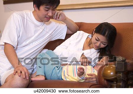 Togetherness, Mother, Love, Father, Daughter, Asian Ethnicity View Large Photo Image Stock Image - Togetherness, Mother, Love, Father, Daughter, Asian Ethnicity. Fotosearch