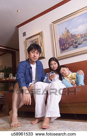 Stock Image - Togetherness, Mother, Love, Father, Daughter, Asian Ethnicity. Fotosearch