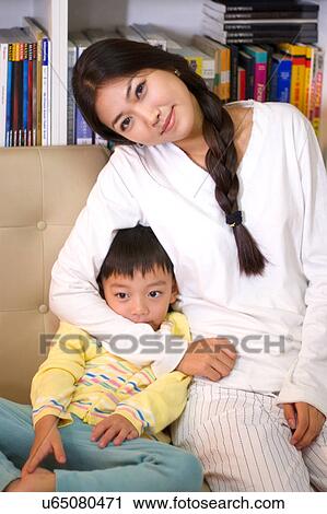 Stock Image - Togetherness, Mother, Love, Father, Daughter, Asian Ethnicity. Fotosearch