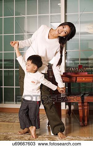 Togetherness, Mother, Love, Father, Daughter, Asian Ethnicity View Large Photo Image Stock Image - Togetherness, Mother, Love, Father, Daughter, Asian Ethnicity. Fotosearch