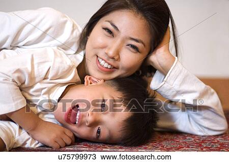 Togetherness, Mother, Love, Father, Daughter, Asian Ethnicity View Large Photo Image Stock Image - Togetherness, Mother, Love, Father, Daughter, Asian Ethnicity. Fotosearch