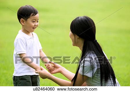 Togetherness, Mother, Love, Father, Daughter, Asian Ethnicity View Large Photo Image Stock Image - Togetherness, Mother, Love, Father, Daughter, Asian Ethnicity. Fotosearch
