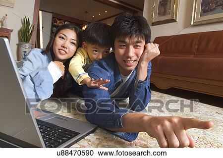 Togetherness, Mother, Love, Father, Daughter, Asian Ethnicity View Large Photo Image Stock Image - Togetherness, Mother, Love, Father, Daughter, Asian Ethnicity. Fotosearch