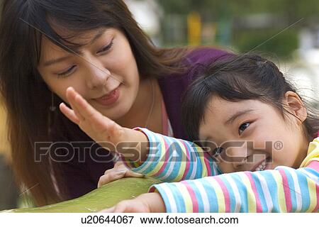 Togetherness, Mother, Love, Father, Daughter, Asian Ethnicity View Large Photo Image Stock Photo - Togetherness, Mother, Love, Father, Daughter, Asian Ethnicity. Fotosearch