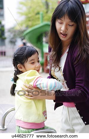 Togetherness, Mother, Love, Father, Daughter, Asian Ethnicity View Large Photo Image Stock Photo - Togetherness, Mother, Love, Father, Daughter, Asian Ethnicity. Fotosearch