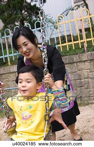 Togetherness, Mother, Love, Father, Daughter, Asian Ethnicity View Large Photo Image Stock Photography - Togetherness, Mother, Love, Father, Daughter, Asian Ethnicity. Fotosearch