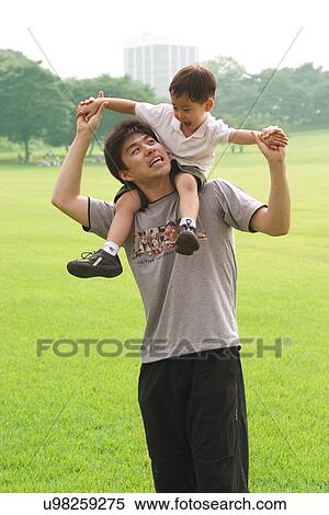 Stock Photography - Togetherness, Mother, Love, Father, Daughter, Asian Ethnicity. Fotosearch
