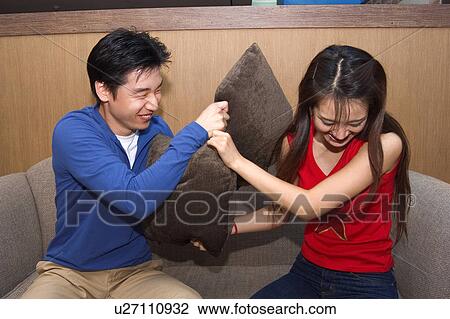 Stock Image - Togetherness, Young Men, Young Adult, Young Couple, Young Women, Asian Ethnicity. Fotosearch