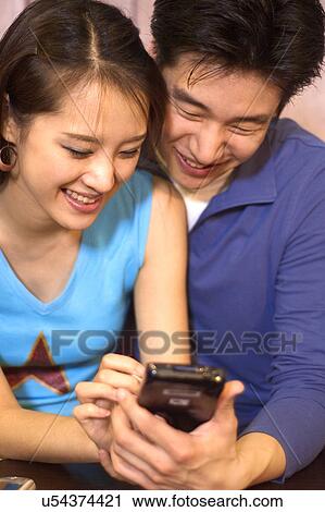 Togetherness, Young Men, Young Adult, Young Couple, Young Women, Asian Ethnicity View Large Photo Image Stock Image - Togetherness, Young Men, Young Adult, Young Couple, Young Women, Asian Ethnicity. Fotosearch