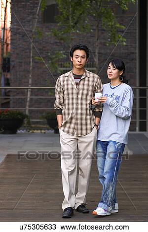 Stock Image - Togetherness, Young Men, Young Adult, Young Couple, Young Women, Asian Ethnicity. Fotosearch