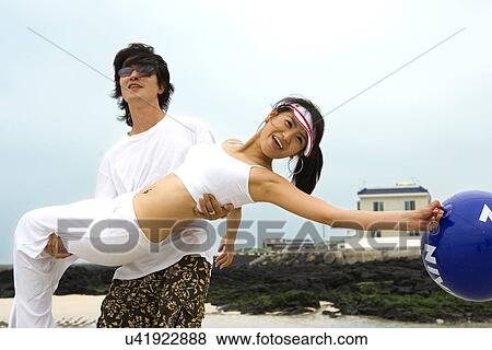 Stock Photo - Togetherness, Young Men, Young Adult, Young Couple, Young Women, Asian Ethnicity. Fotosearch