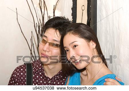 Togetherness, Young Men, Young Adult, Young Couple, Young Women, Asian Ethnicity View Large Photo Image Stock Photo - Togetherness, Young Men, Young Adult, Young Couple, Young Women, Asian Ethnicity. Fotosearch