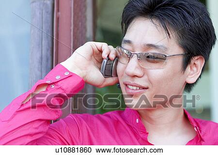 Stock Image - Wireless Technology, Mobile Phone, Laptop, Connected, New Age, Happiness, Youth. Fotosearch