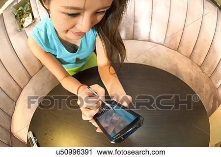 Stock Image - Wireless Technology, Mobile Phone, Laptop, Connected, New Age, Happiness, Youth. Fotosearch