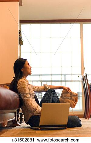 Stock Image - Wireless Technology, Mobile Phone, Laptop, Connected, New Age, Happiness, Youth. Fotosearch