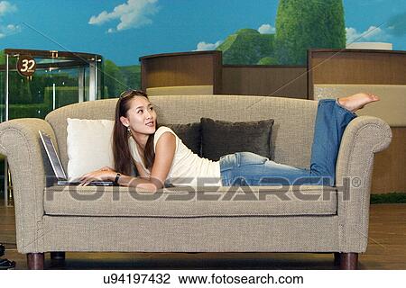 Stock Image - Wireless Technology, Mobile Phone, Laptop, Connected, New Age, Happiness, Youth. Fotosearch