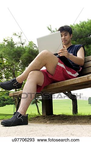Stock Image - Wireless Technology, Mobile Phone, Laptop, Connected, New Age, Happiness, Youth. Fotosearch