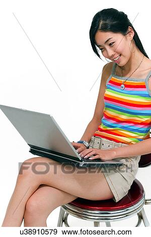 Stock Photo - Wireless Technology, Mobile Phone, Laptop, Connected, New Age, Happiness, Youth. Fotosearch