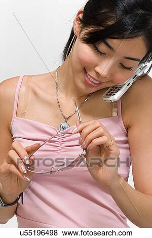 Stock Photo - Wireless Technology, Mobile Phone, Laptop, Connected, New Age, Happiness, Youth. Fotosearch
