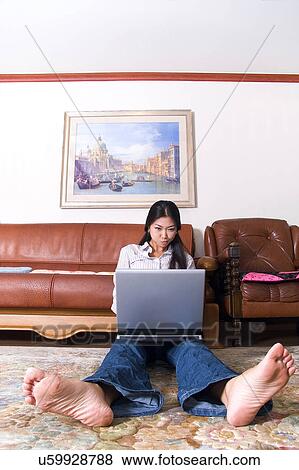 Stock Photo - Wireless Technology, Mobile Phone, Laptop, Connected, New Age, Happiness, Youth. Fotosearch