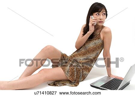 Stock Photo - Wireless Technology, Mobile Phone, Laptop, Connected, New Age, Happiness, Youth. Fotosearch