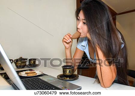 Stock Photo - Wireless Technology, Mobile Phone, Laptop, Connected, New Age, Happiness, Youth. Fotosearch
