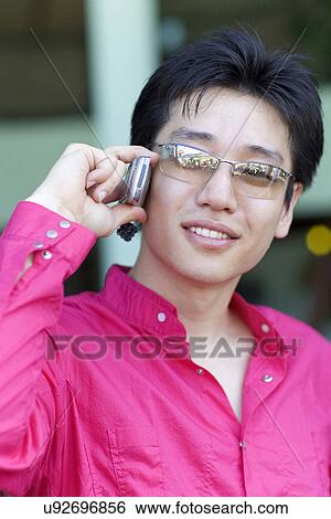 Stock Photograph - Wireless Technology, Mobile Phone, Laptop, Connected, New Age, Happiness, Youth. Fotosearch