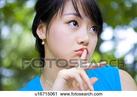 Stock Image - Woman, Female, Portrait, Smiling, Outdoors, Day, Lifestyles. Fotosearch