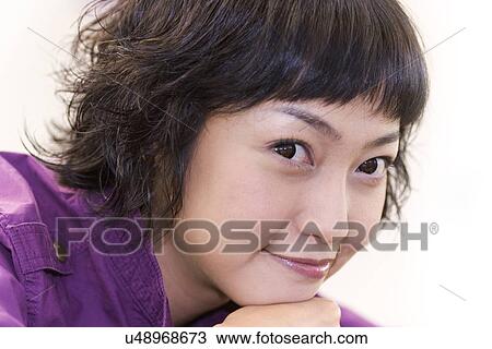 Stock Image - Woman, Female, Portrait, Smiling, Outdoors, Day, Lifestyles. Fotosearch