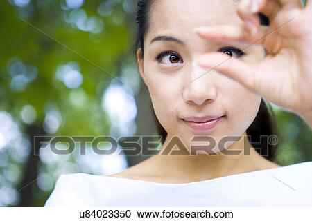 Stock Image - Woman, Female, Portrait, Smiling, Outdoors, Day, Lifestyles. Fotosearch