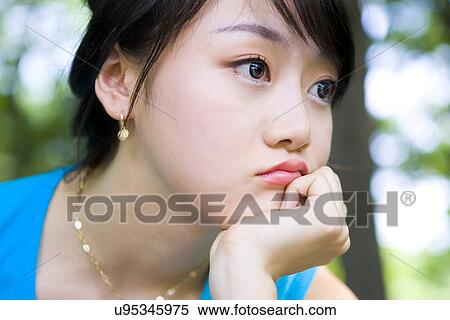 Stock Photography - Woman, Female, Portrait, Smiling, Outdoors, Day, Lifestyles. Fotosearch