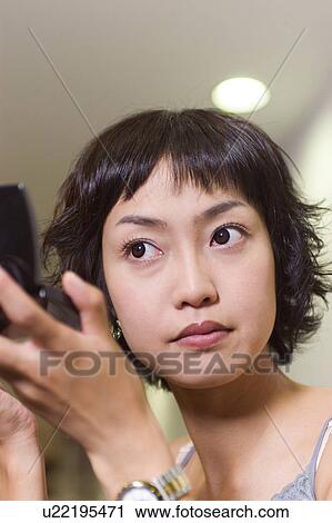 Stock Image - Young Adult, Make-Up, Cosmetics, Beauty Treatment, Therapy, Body Conscious, Body Care. Fotosearch