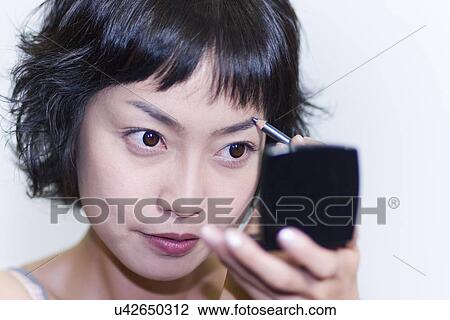Stock Image - Young Adult, Make-Up, Cosmetics, Beauty Treatment, Therapy, Body Conscious, Body Care. Fotosearch