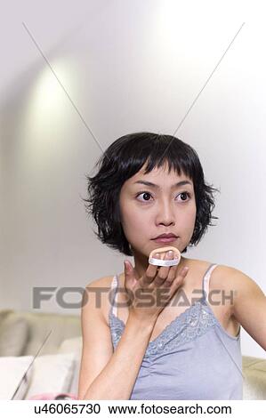 Stock Image - Young Adult, Make-Up, Cosmetics, Beauty Treatment, Therapy, Body Conscious, Body Care. Fotosearch