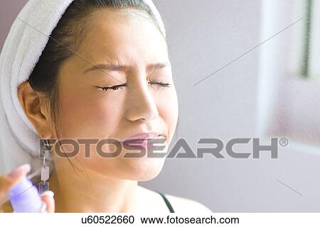 Stock Image - Young Adult, Make-Up, Cosmetics, Beauty Treatment, Therapy, Body Conscious, Body Care. Fotosearch