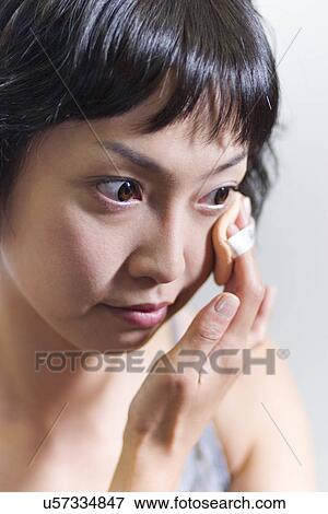 Stock Photo - Young Adult, Make-Up, Cosmetics, Beauty Treatment, Therapy, Body Conscious, Body Care. Fotosearch